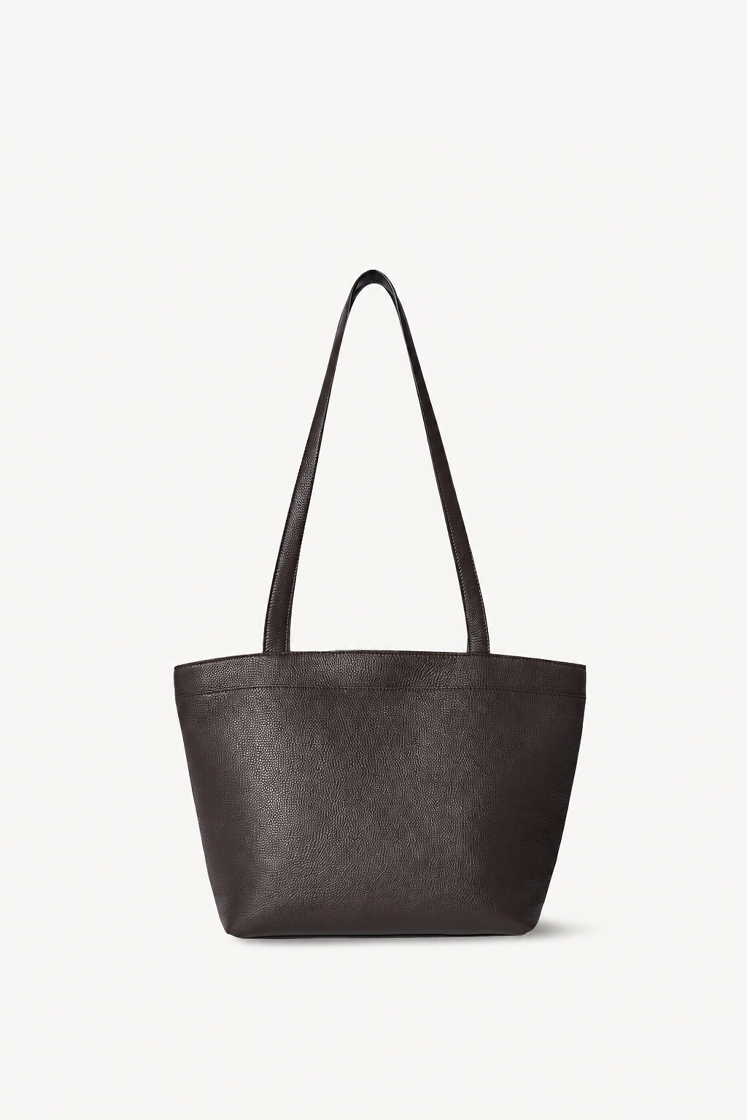 A dark brown leather tote bag with a slouchy, wide body and two long shoulder straps, shown against a plain off-white background.